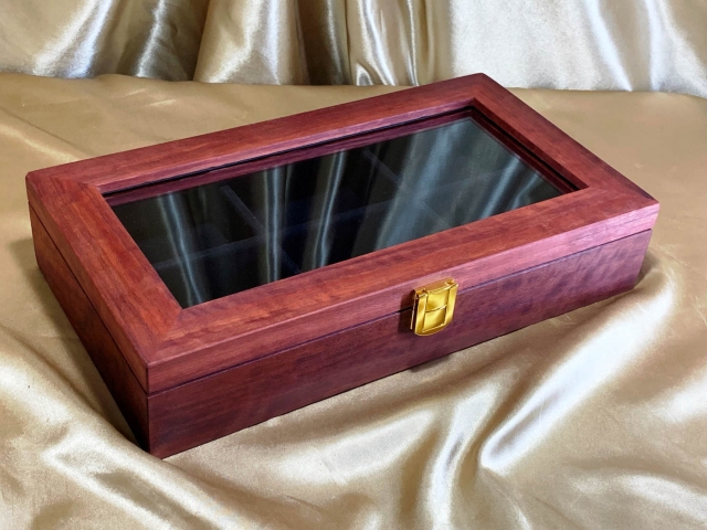 Custom Made Jarrah Display Case with Glass Lid to display a collection of buckles